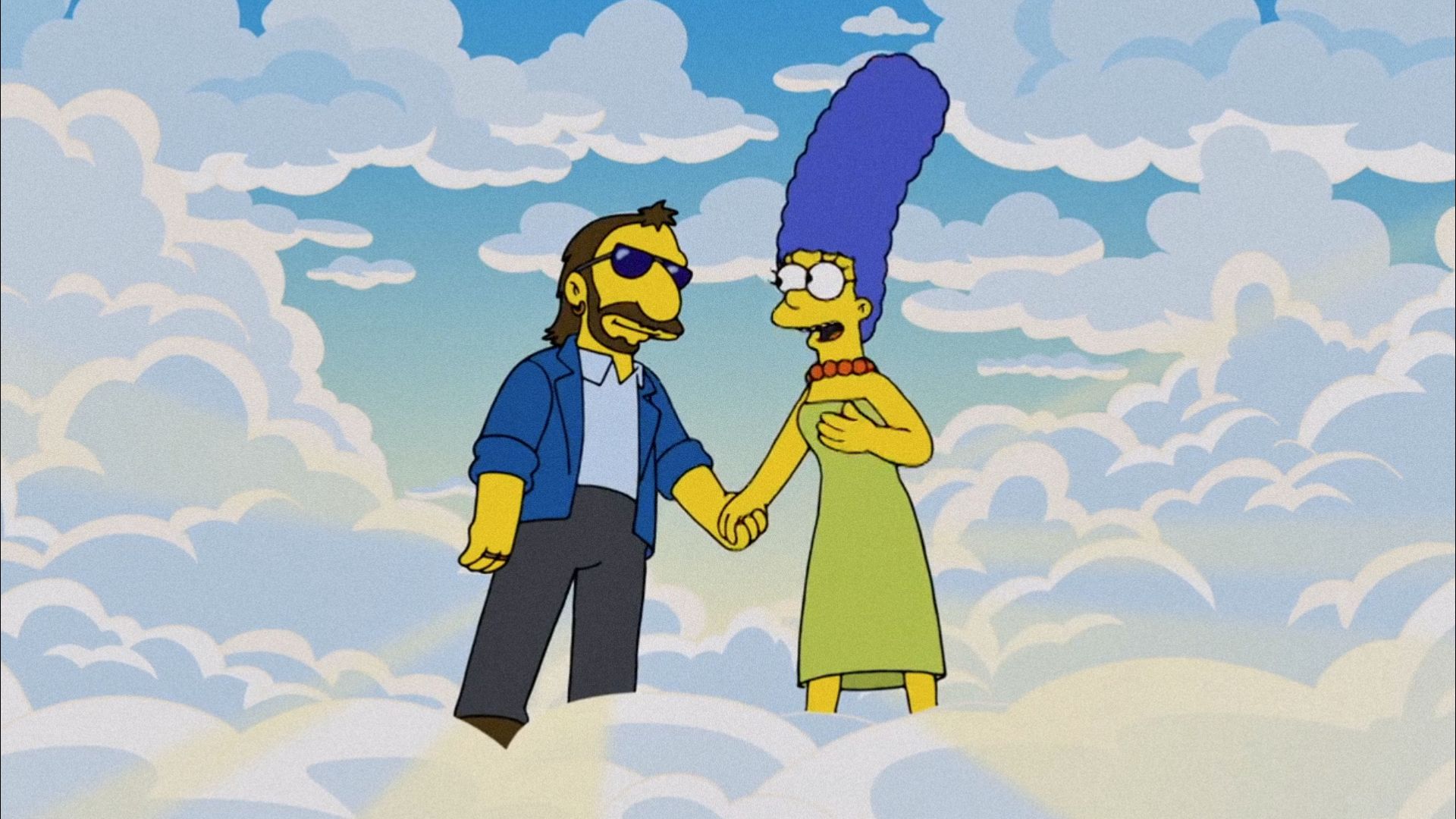 Il cantante Ringo Starr disegnato in stile cartoon e una donna con i capelli blu in piedi sulle nuvole