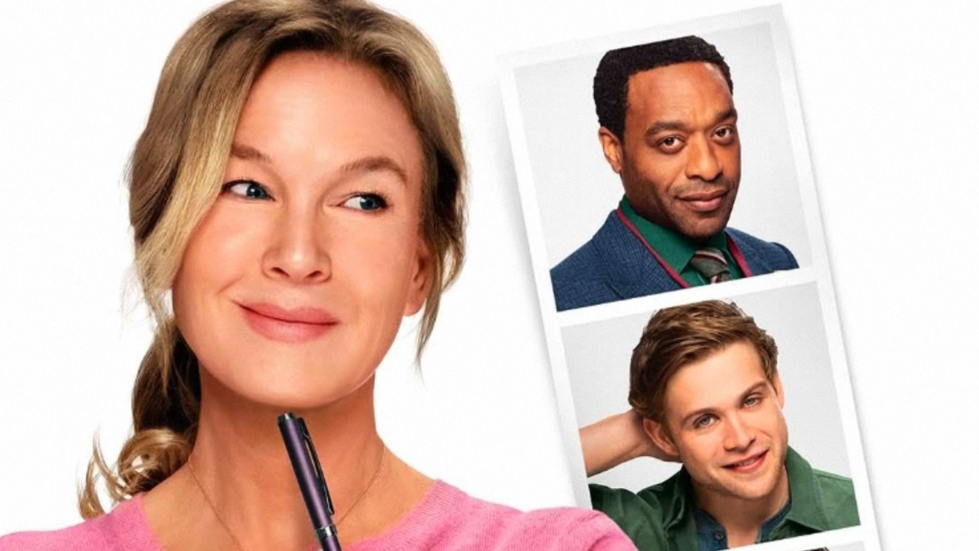 L'attrice Renée Zellweger in camicetta rosa guarda le fotografie di due uomini