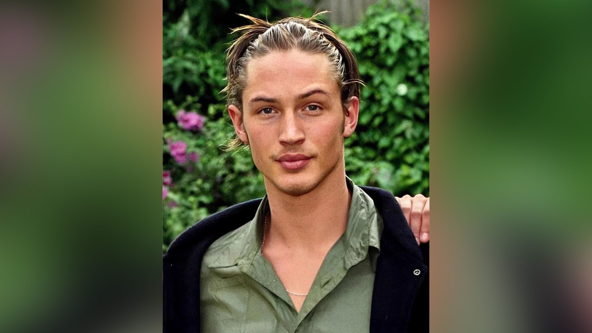 Giovane Tom Hardy con una maglietta verde
