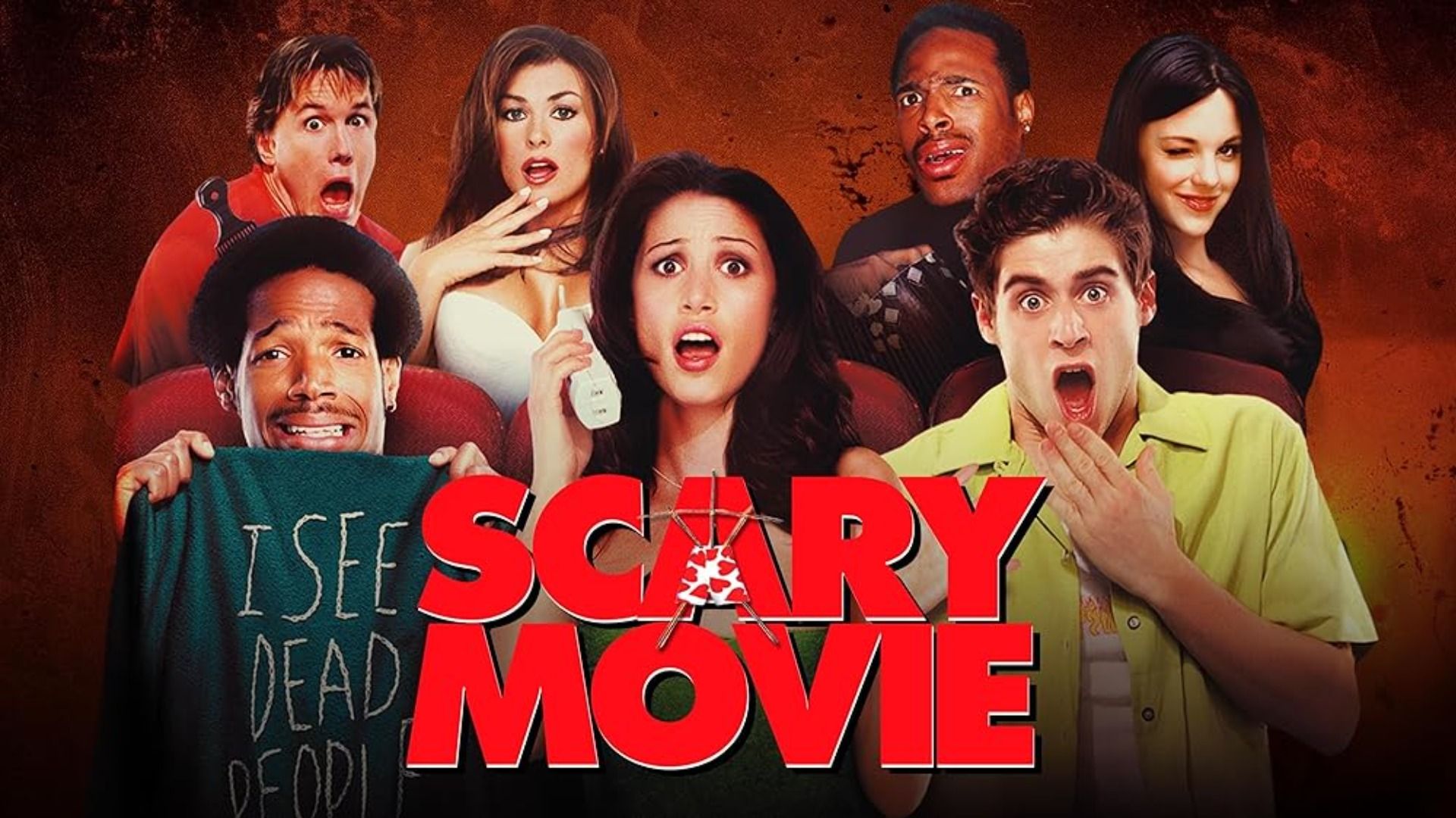 Un gruppo di persone in abiti colorati sedute in un cinema